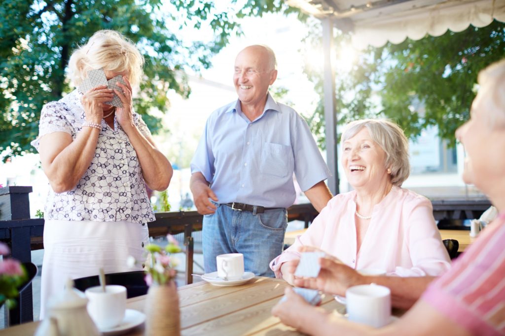 Older adults playing cards and having fun