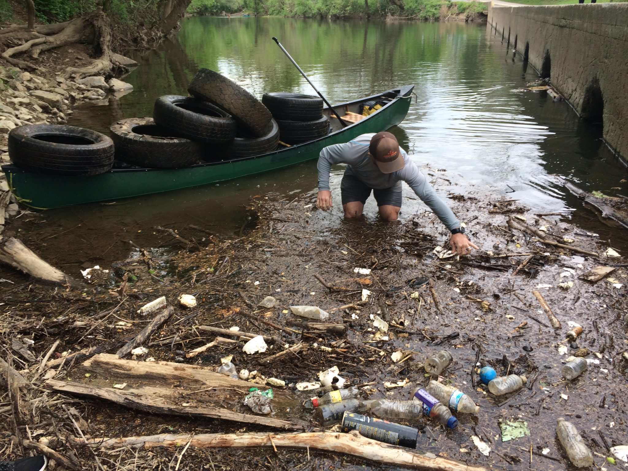 James Cleaning Debris in Roanoke River