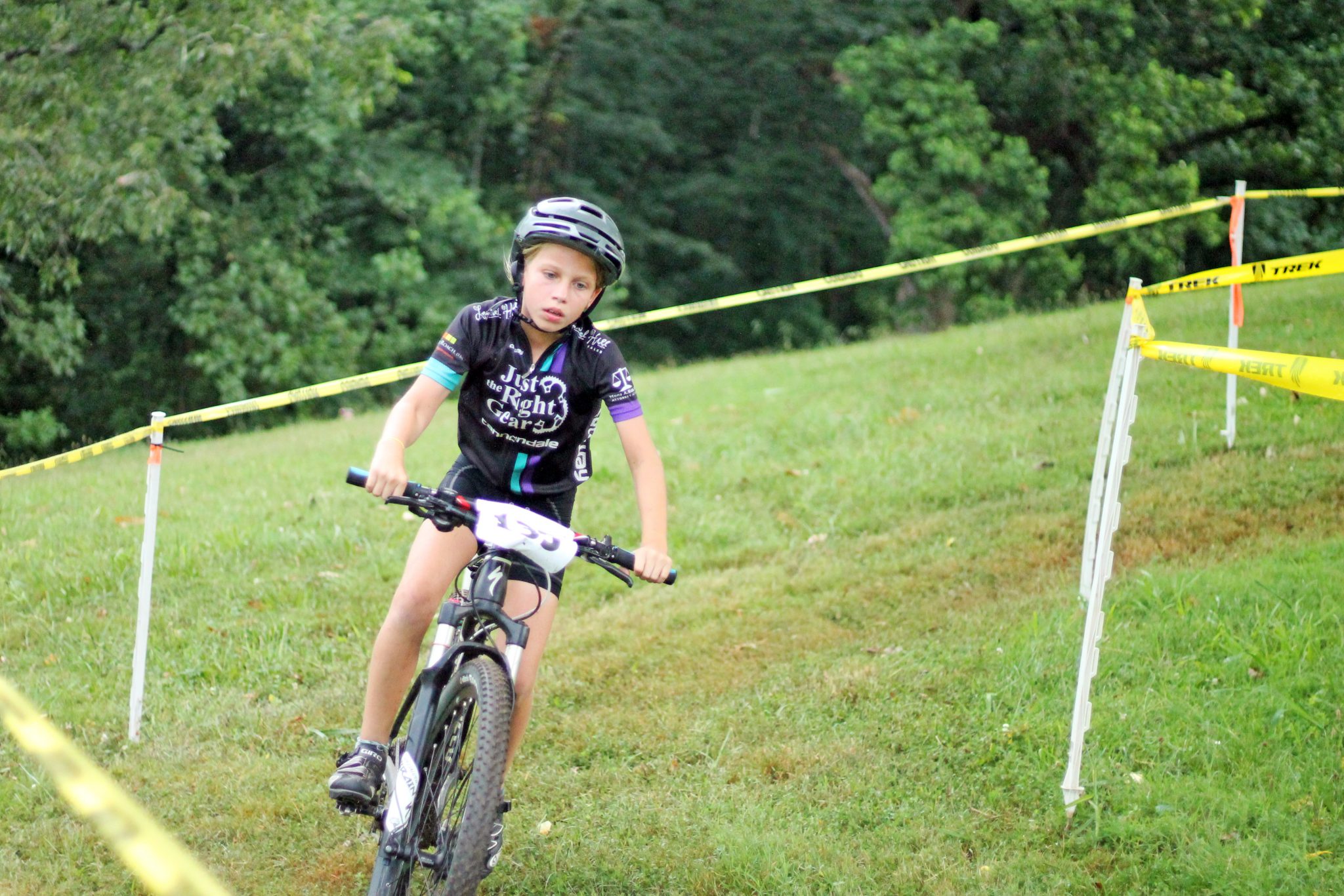 Fishburn youth mountain biker rides out of a turn at the Play Roanoke race event