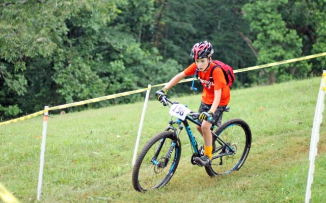 Fishburn youth mountain biker rides out of a turn during the mountain bike race in Fishburn Park