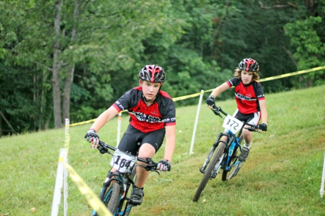 Fishburn youth mountain bikers ride out of a turn during the 2017 youth mountain bike race event
