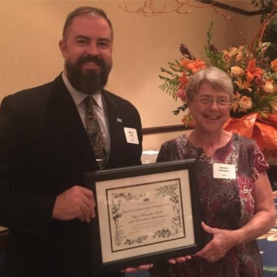 Michael Clark, Director of Parks and Recreation, and Marilyn Arbogast, Landscape Coordinator, accepting award from the Garden Clubs of America