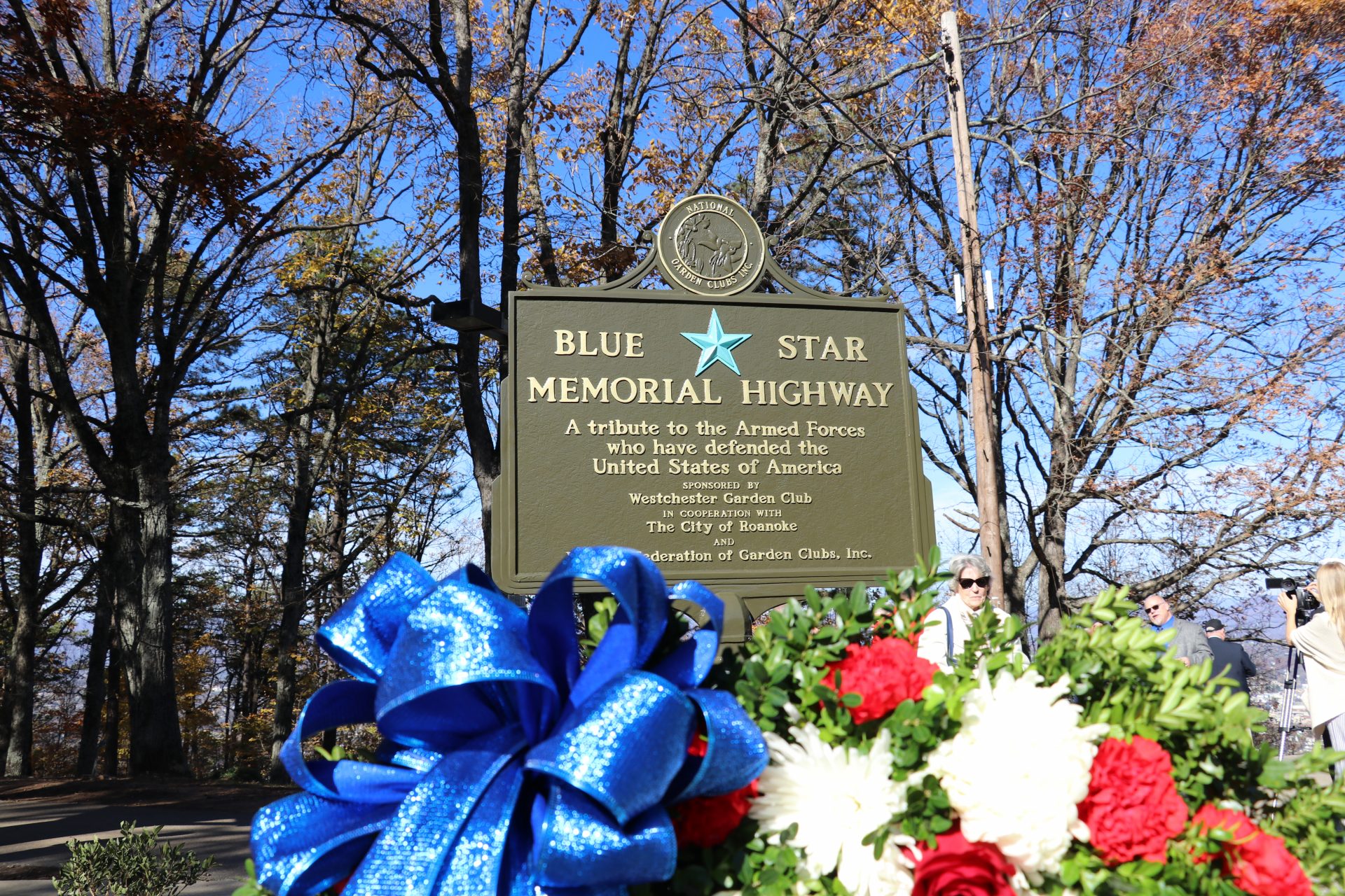 New Blue Star Memorial Marker with large wreath in the foreground.