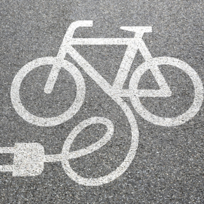 Pictograph of bicycle with plus coming out of it for electric bicycle