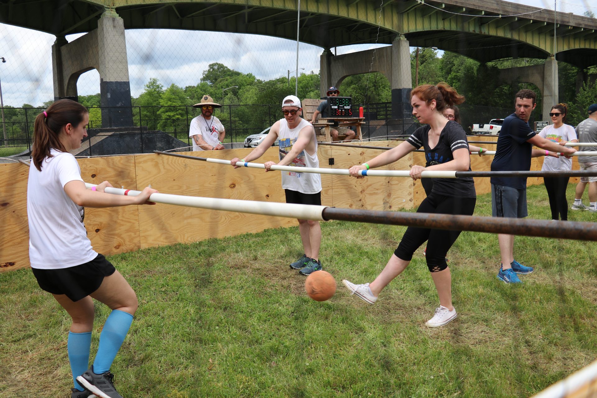 Group playing Human Foosball in the park