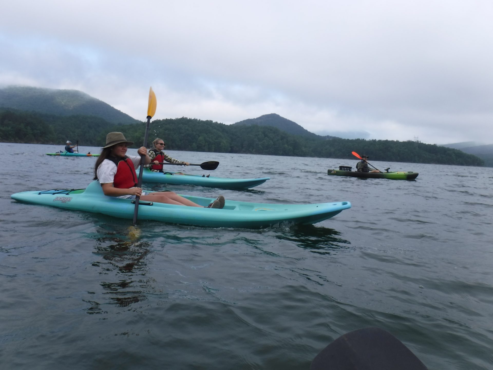 People in kayaks on the water