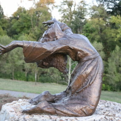 Vic Thomas Scultpure Sculpture of young woman bent backwards in the wind