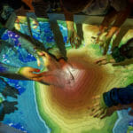 Children play with Augmented Reality Sandbox