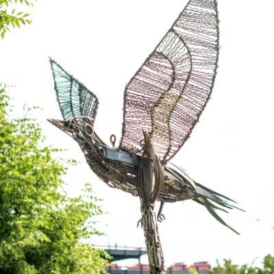 Larger than Life Sculpture resembling a paintbrush and pileated woodpecker
