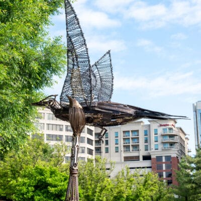Larger than Life Sculpture resembling a paintbrush and pileated woodpecker