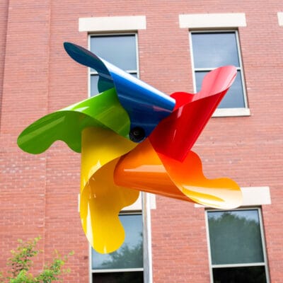 Larger than Life Sculpture resembling a colorful pinwheel