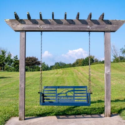 Countryside Park Greenway and Trails Swinging bench with rolling hills