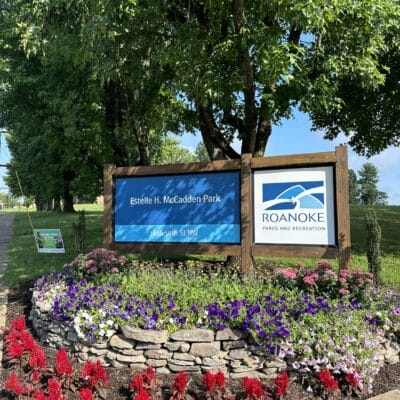 Estelle H. McCadden Park McCadden Park sign with rock wall and floral landscaping