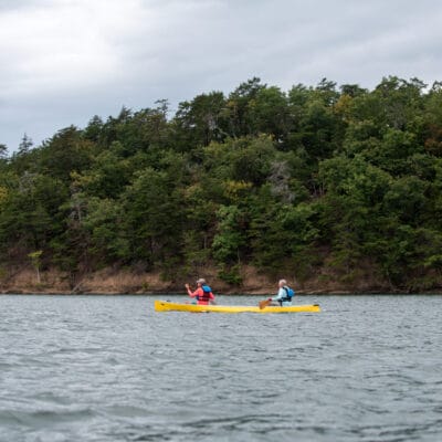 Canoeing at Carvins Cove a yellow canoe with two paddlers at Carvins Cove