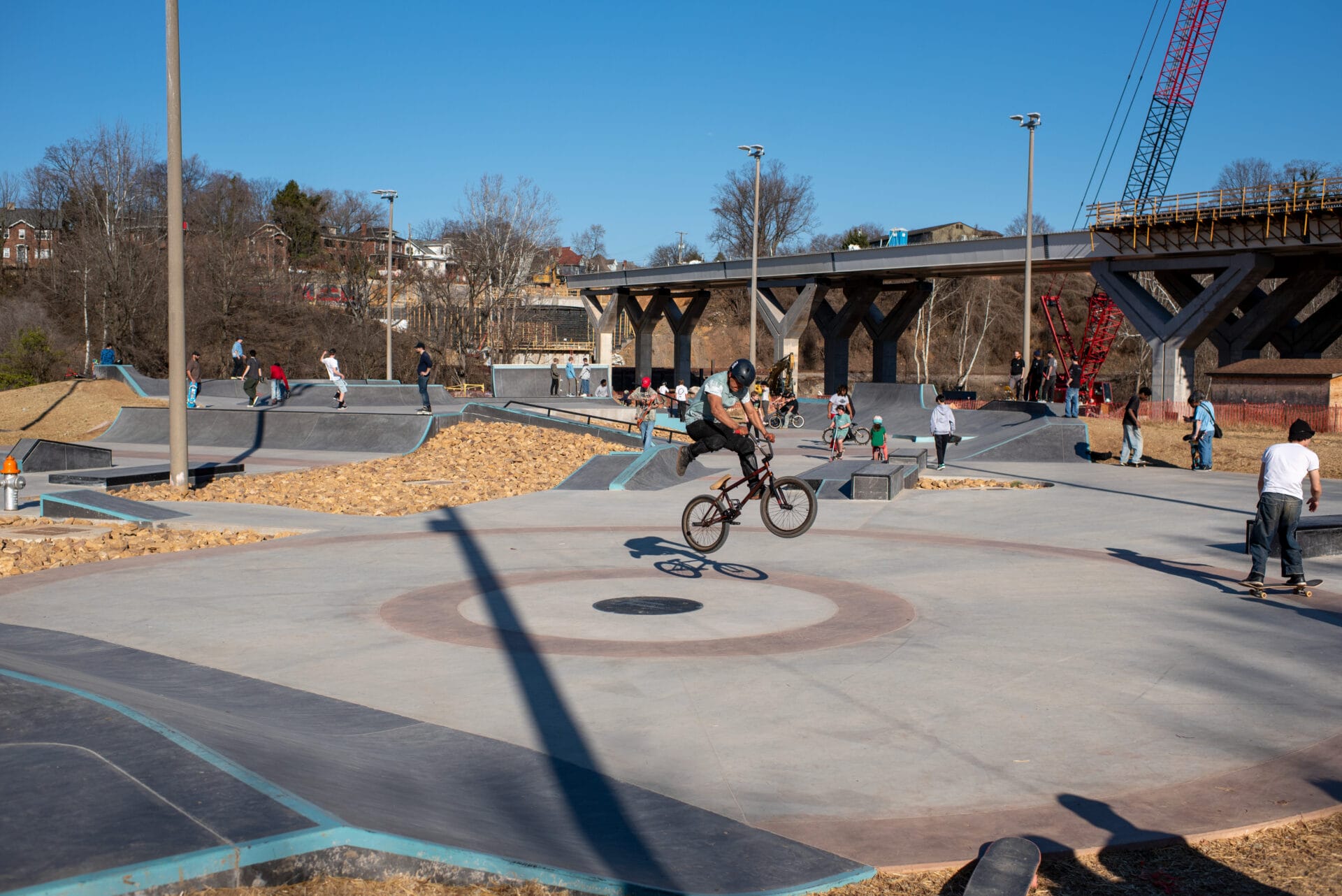 A BMX biker and others enjoy a large skatepark in Roanoke, Virginia.