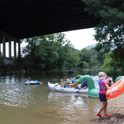 A group of tubers and paddlers in the Roanoke River at Smith Park and Wiley Drive.