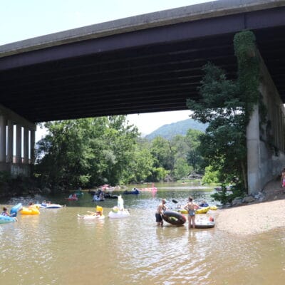 A group of tubers and paddlers in the Roanoke River at Smith Park and Wiley Drive.