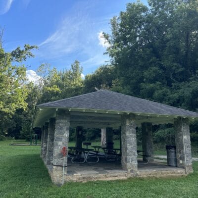 Fishburn Park lower (stone) shelter and swings Stone park shelter with swingset nearby.