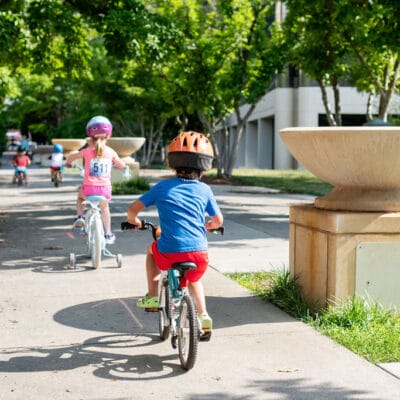 TinyTotTri26 873web Children ride bikes as part of a 'triathlon' event for toddlers and small children.